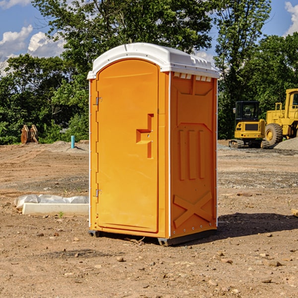 what is the cost difference between standard and deluxe portable restroom rentals in Harrison NE